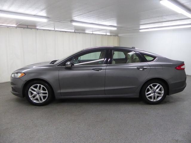 used 2014 Ford Fusion car, priced at $5,000