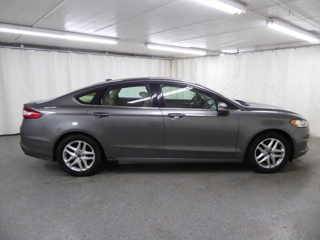 used 2014 Ford Fusion car, priced at $5,000