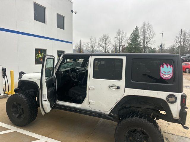 used 2015 Jeep Wrangler Unlimited car, priced at $15,991