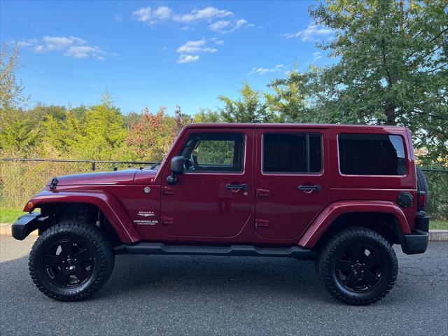 used 2011 Jeep Wrangler Unlimited car, priced at $13,999