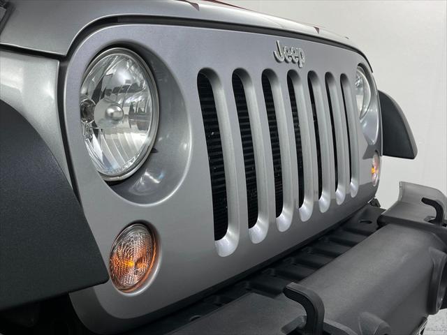 used 2015 Jeep Wrangler Unlimited car, priced at $21,055