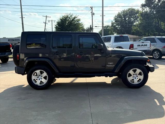 used 2010 Jeep Wrangler Unlimited car, priced at $13,497