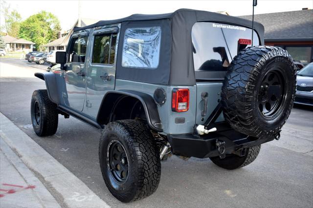 used 2015 Jeep Wrangler Unlimited car, priced at $21,697