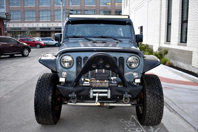 used 2015 Jeep Wrangler Unlimited car, priced at $21,697