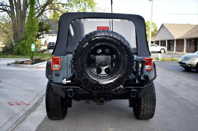 used 2015 Jeep Wrangler Unlimited car, priced at $21,697