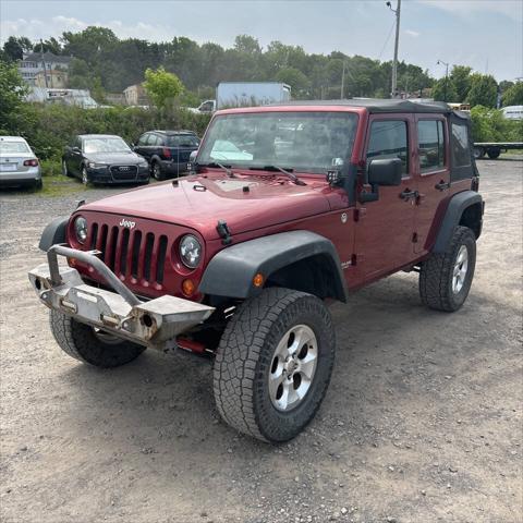 used 2011 Jeep Wrangler Unlimited car, priced at $10,995