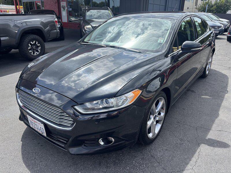 used 2014 Ford Fusion car, priced at $3,988