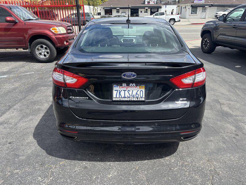 used 2014 Ford Fusion car, priced at $3,988
