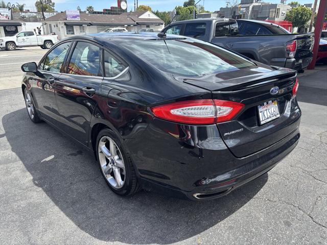 used 2014 Ford Fusion car, priced at $4,588