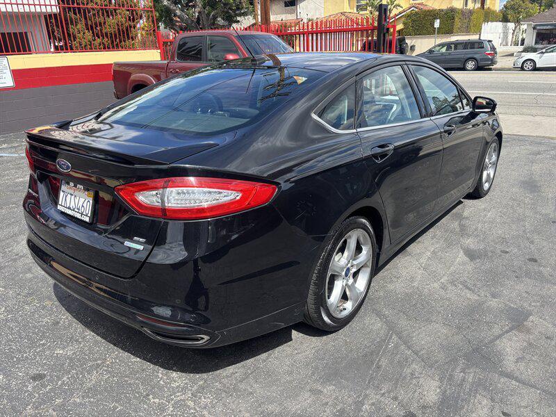 used 2014 Ford Fusion car, priced at $3,988