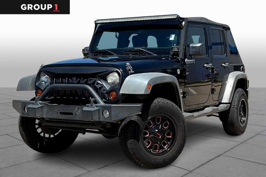used 2012 Jeep Wrangler Unlimited car, priced at $12,336