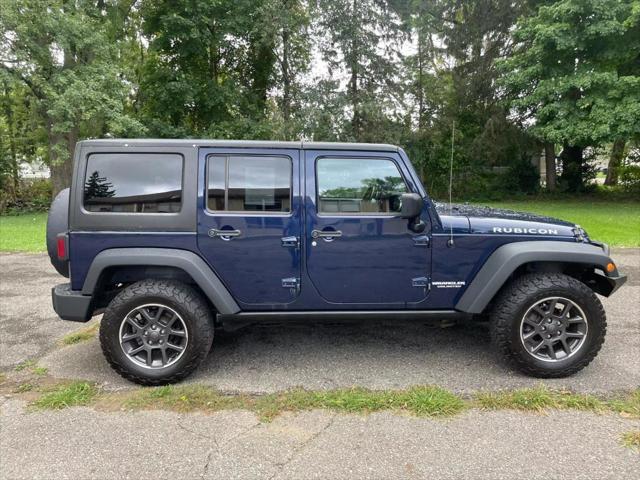 used 2013 Jeep Wrangler Unlimited car, priced at $13,900