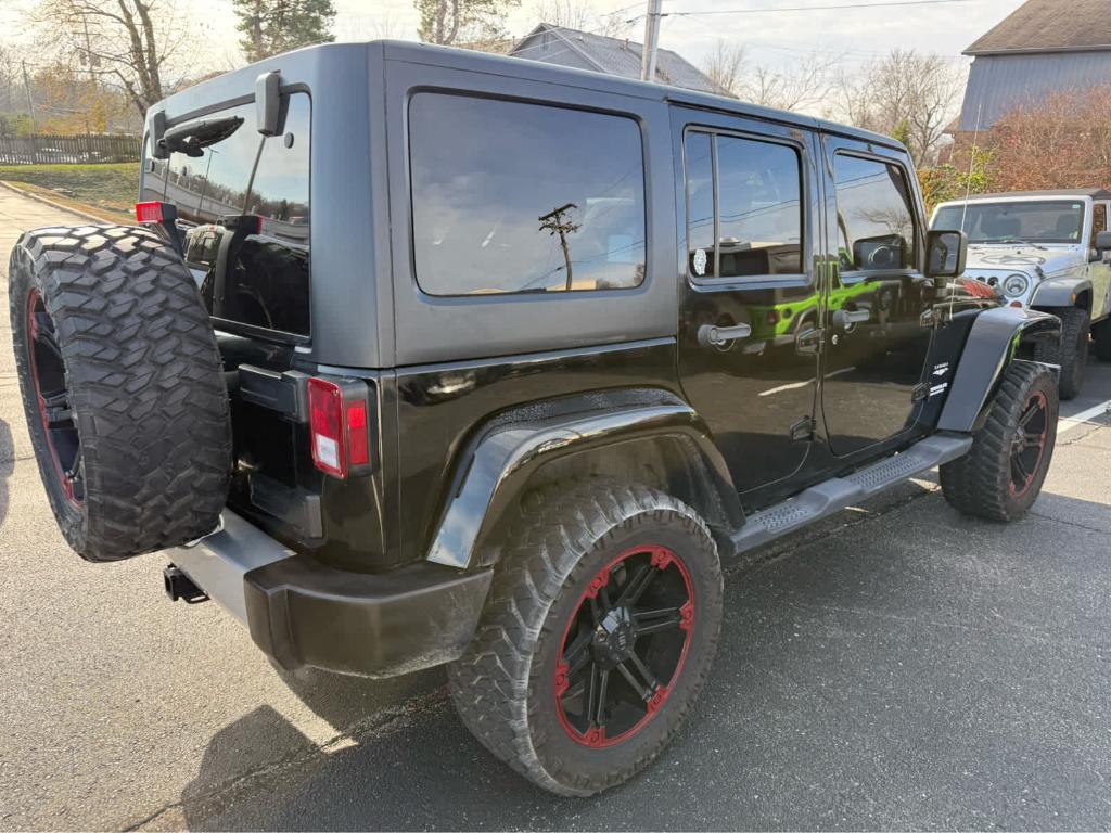 used 2011 Jeep Wrangler Unlimited car, priced at $14,485