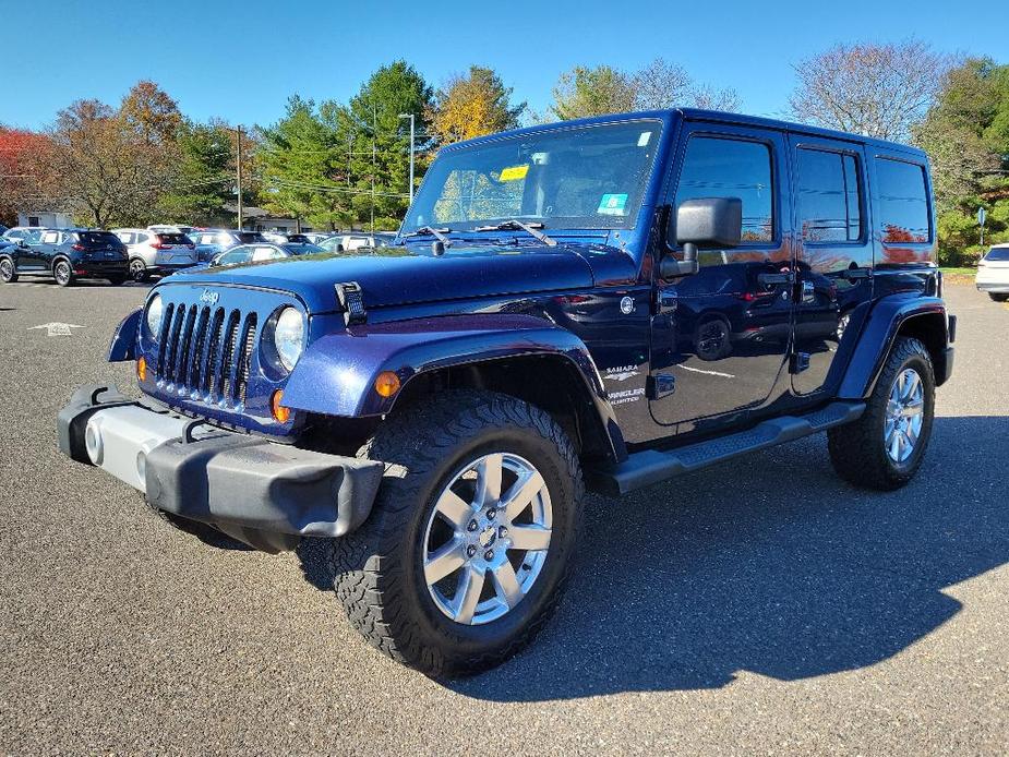 used 2013 Jeep Wrangler Unlimited car, priced at $18,489