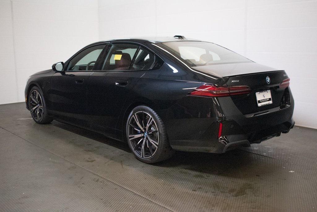 used 2025 BMW 550e car, priced at $69,995