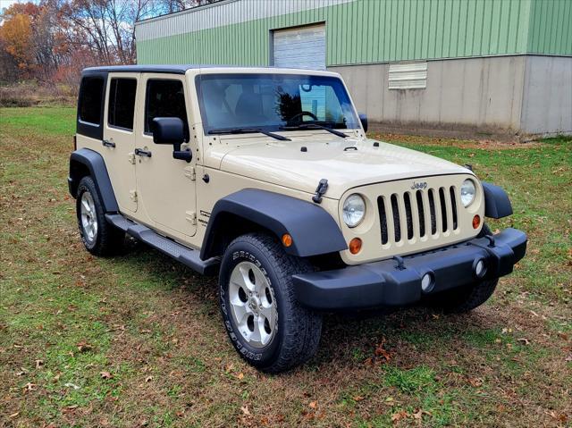 used 2011 Jeep Wrangler Unlimited car, priced at $13,950