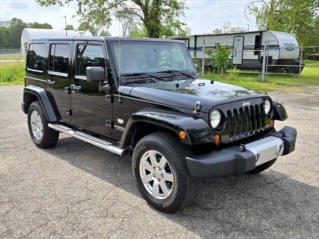 used 2011 Jeep Wrangler Unlimited car, priced at $12,950