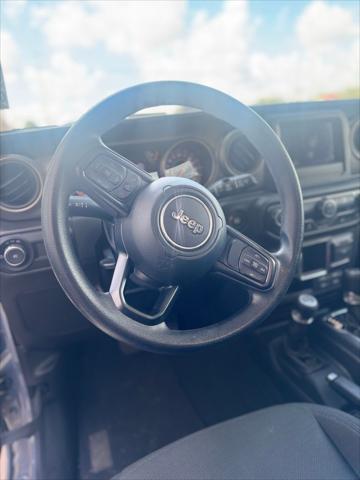 used 2023 Jeep Wrangler car, priced at $27,700