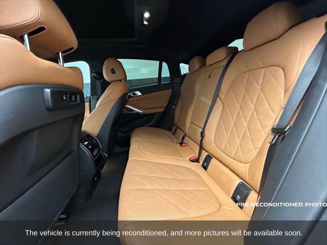 used 2023 BMW X6 car, priced at $54,988