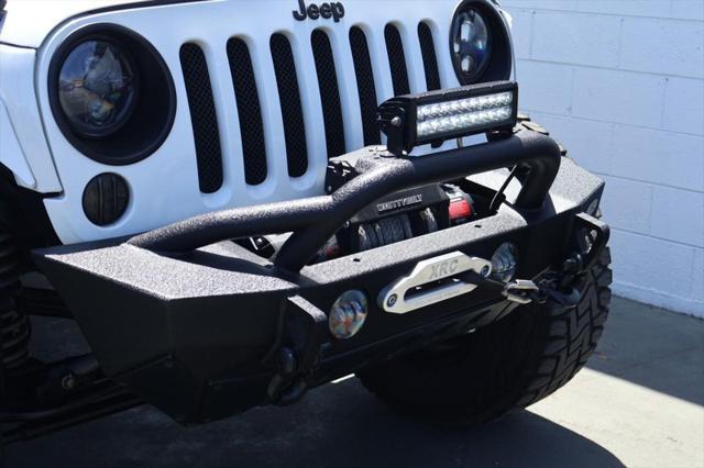 used 2015 Jeep Wrangler Unlimited car, priced at $36,991