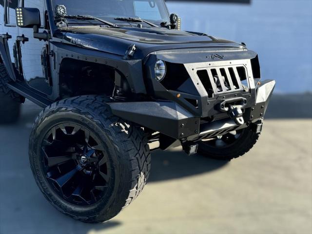 used 2016 Jeep Wrangler Unlimited car, priced at $32,594