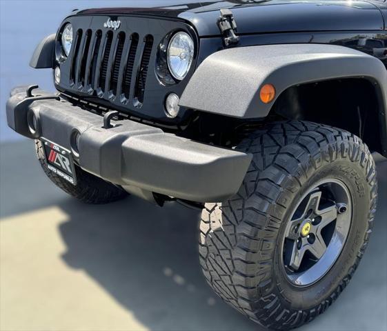 used 2014 Jeep Wrangler Unlimited car, priced at $25,992