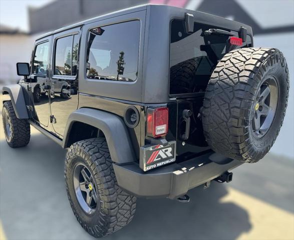 used 2014 Jeep Wrangler Unlimited car, priced at $25,992