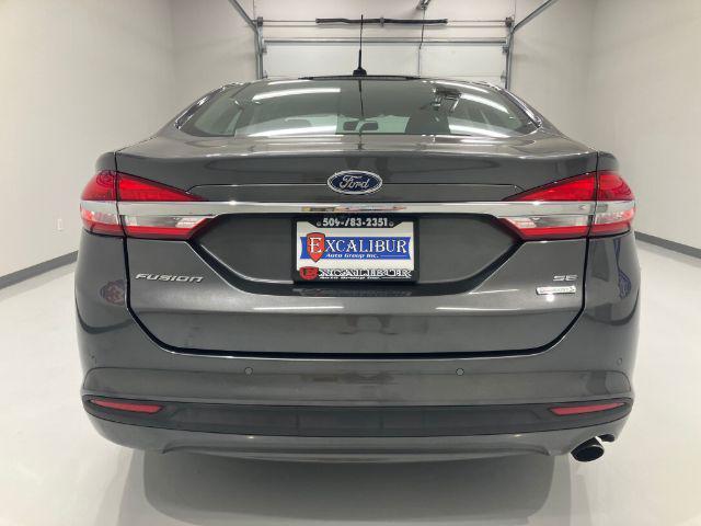 used 2018 Ford Fusion car, priced at $14,673