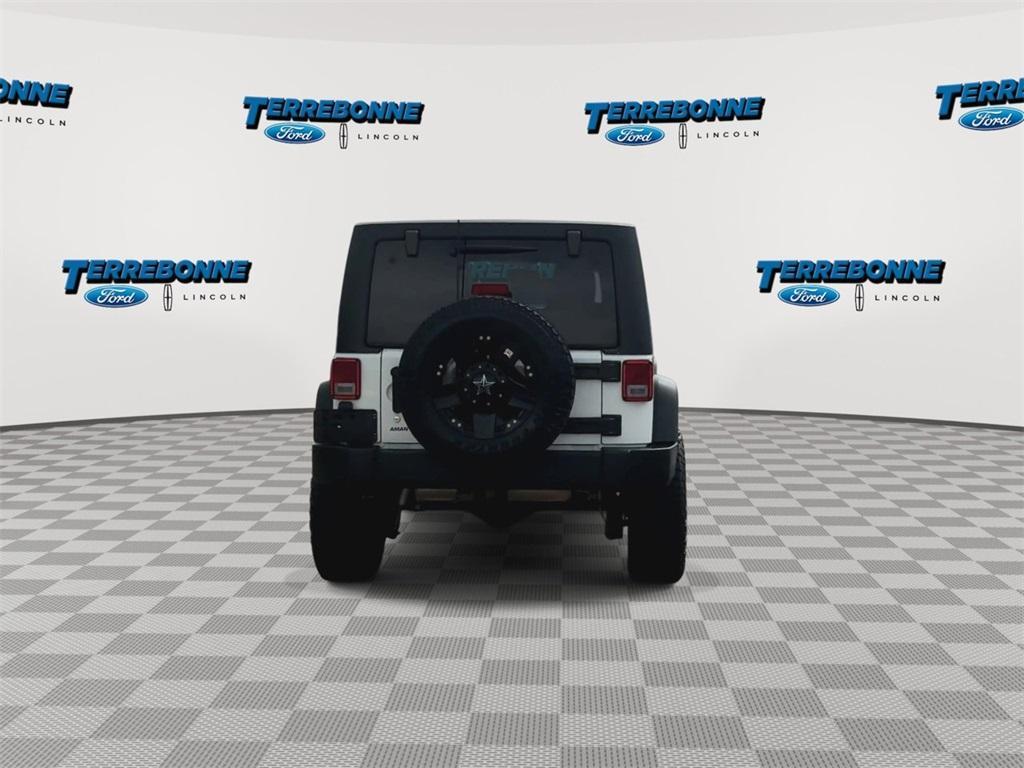 used 2015 Jeep Wrangler Unlimited car, priced at $19,318