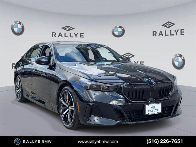 used 2025 BMW 550e car, priced at $69,998