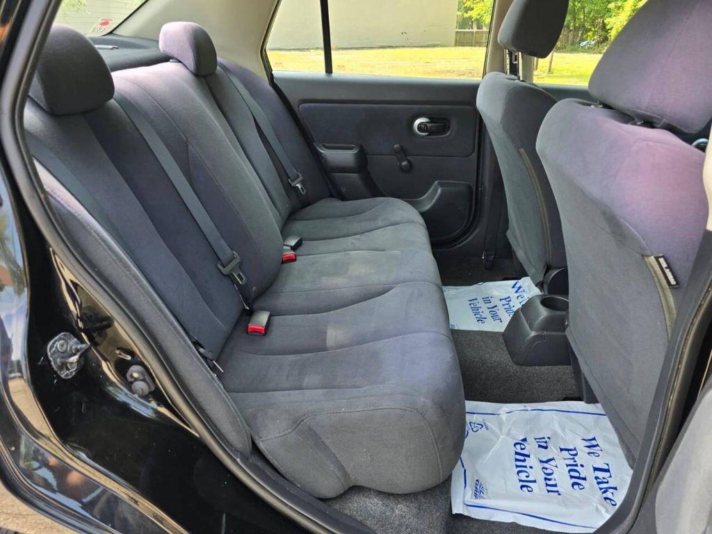 used 2009 Nissan Versa car, priced at $2,999