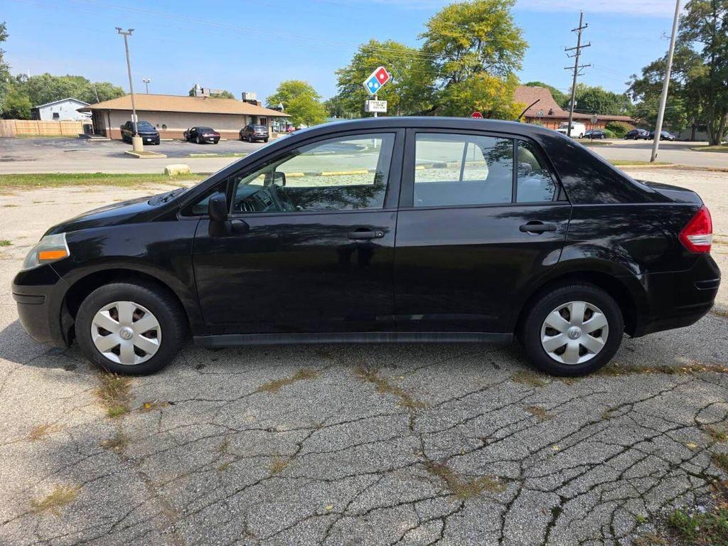 used 2009 Nissan Versa car, priced at $2,999
