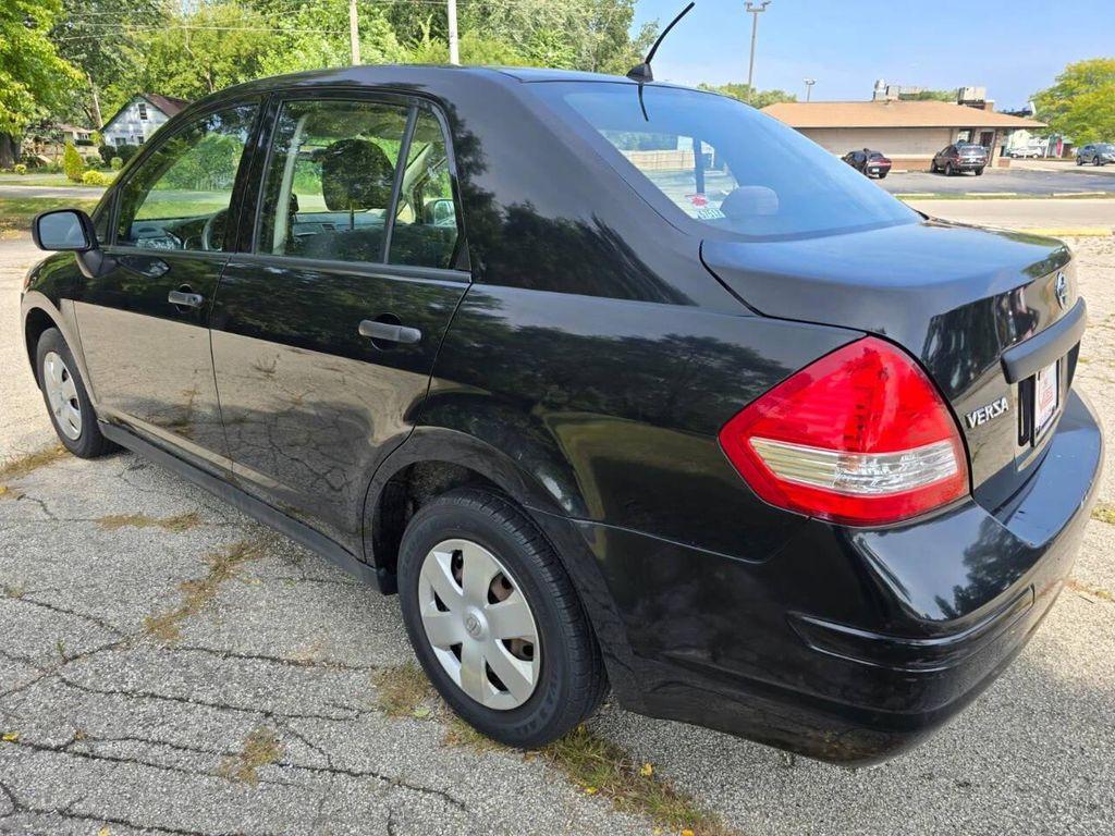 used 2009 Nissan Versa car, priced at $2,999