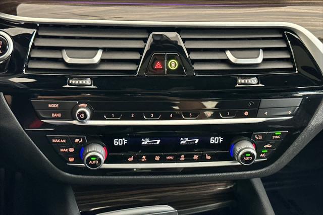 used 2023 BMW 530e car, priced at $33,000