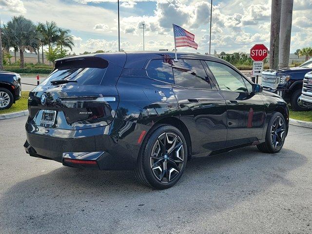 used 2024 BMW iX car, priced at $63,990