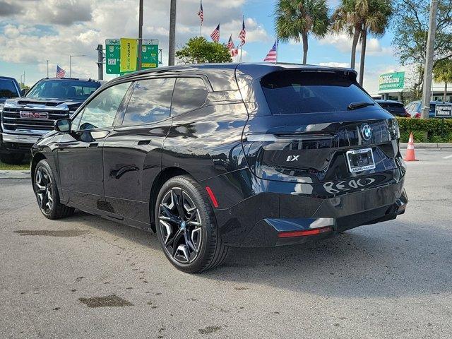 used 2024 BMW iX car, priced at $63,990