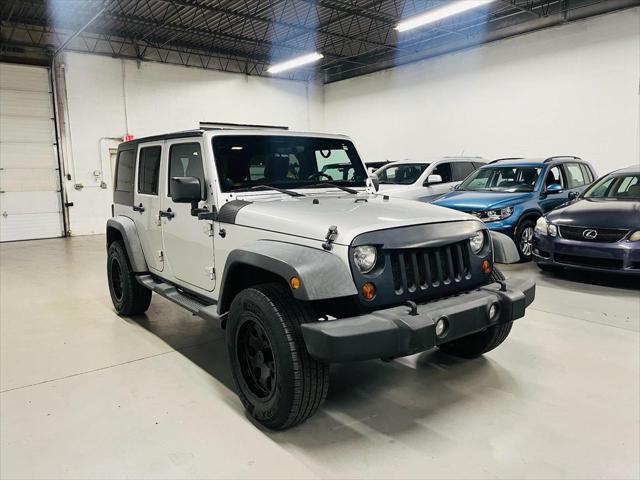 used 2011 Jeep Wrangler Unlimited car, priced at $12,900