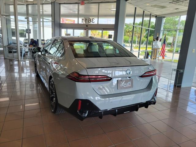 used 2024 BMW i5 car, priced at $64,995