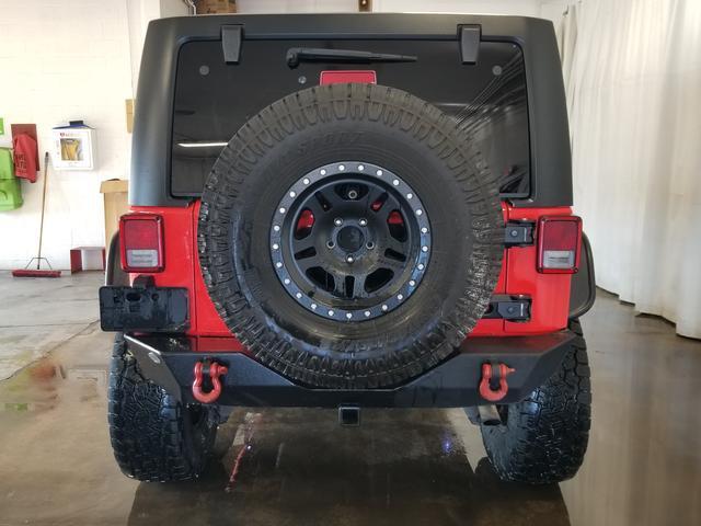 used 2013 Jeep Wrangler Unlimited car, priced at $15,394