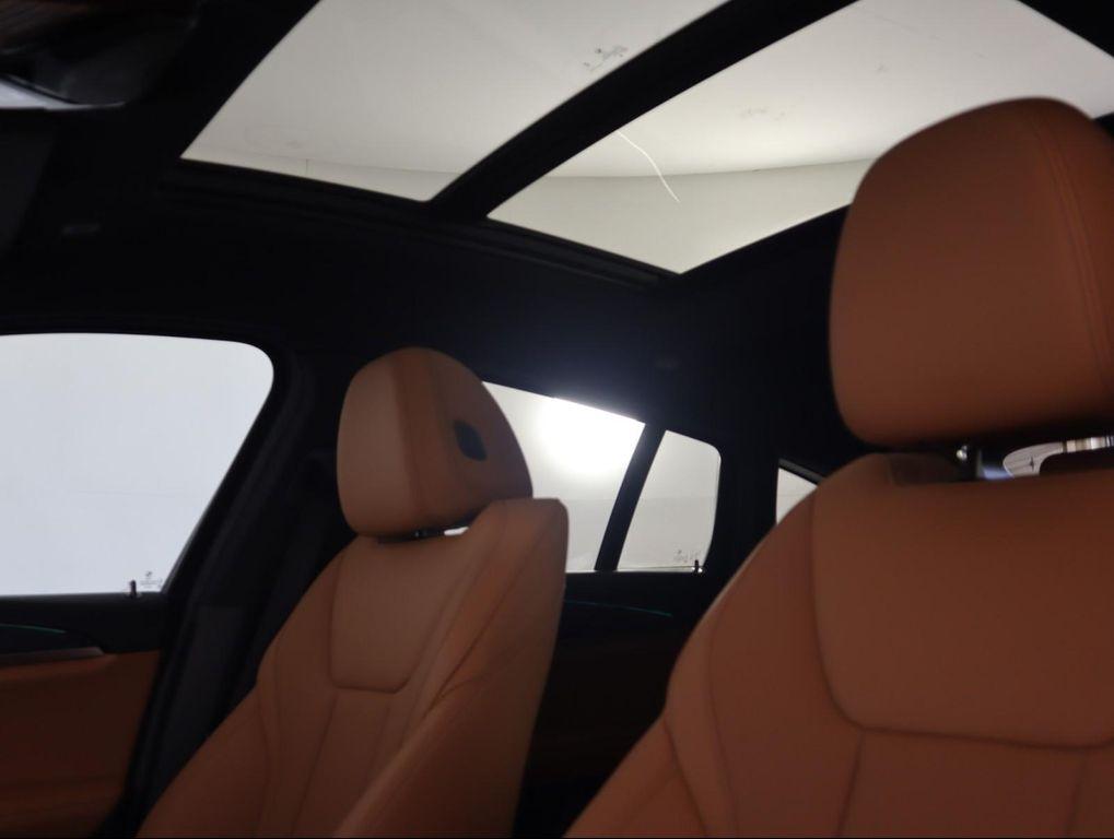 used 2025 BMW X4 car, priced at $52,500