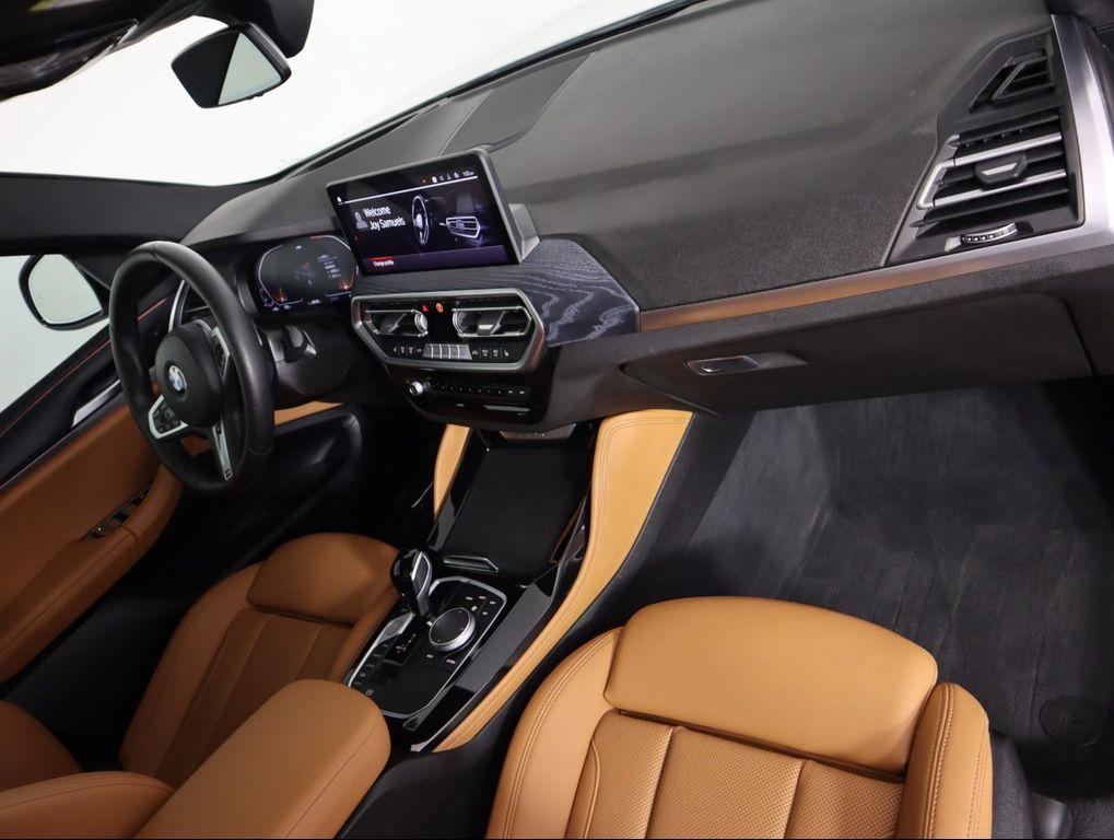 used 2025 BMW X4 car, priced at $52,500