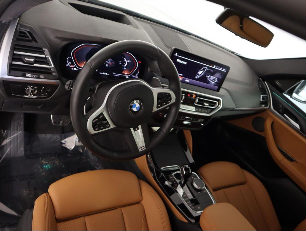 used 2025 BMW X4 car, priced at $52,500