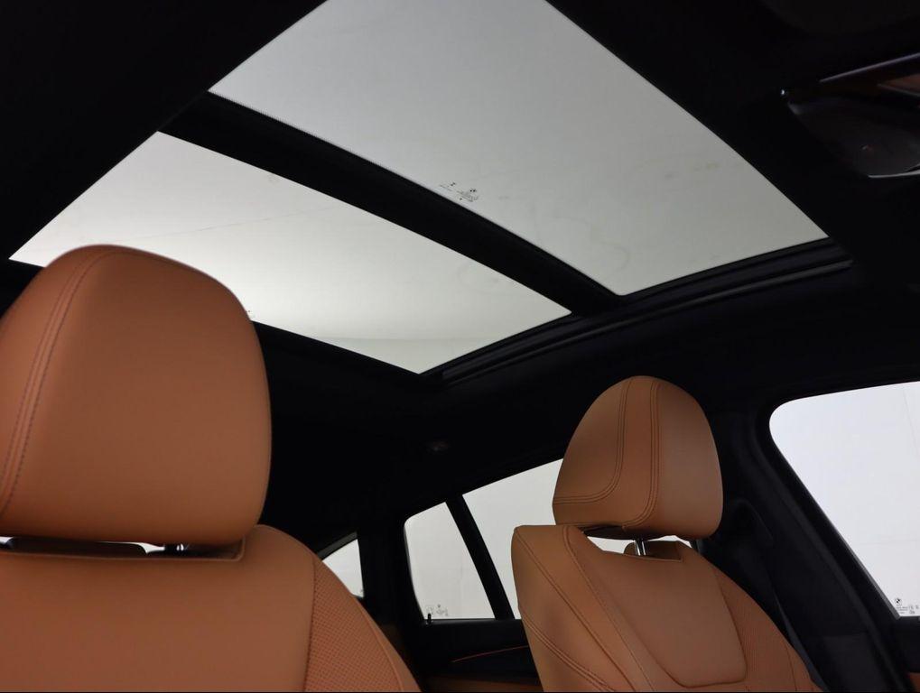 used 2025 BMW X4 car, priced at $52,500