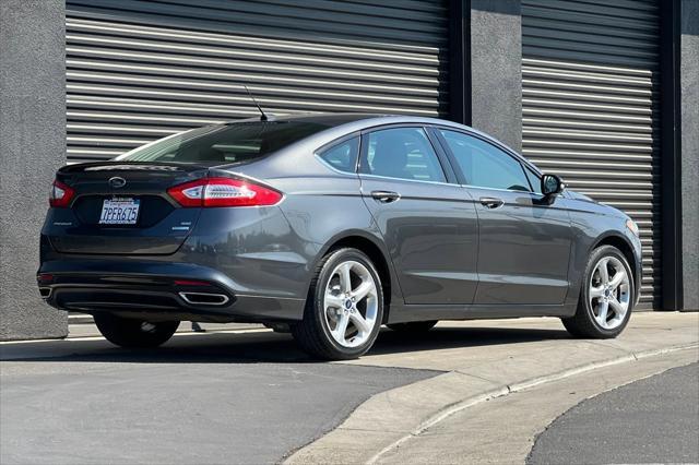 used 2015 Ford Fusion car, priced at $9,989