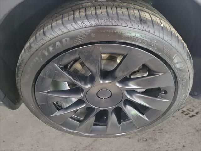 used 2023 Tesla Model Y car, priced at $30,899