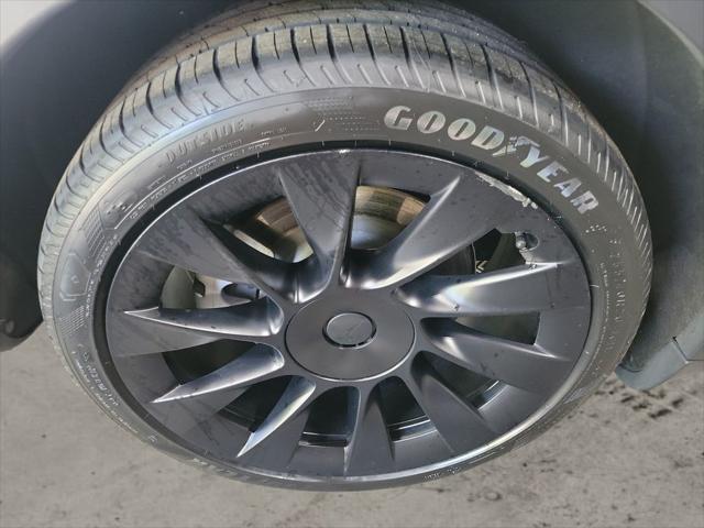 used 2023 Tesla Model Y car, priced at $30,899