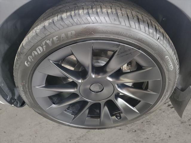 used 2023 Tesla Model Y car, priced at $30,899