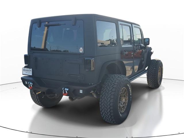 used 2011 Jeep Wrangler Unlimited car, priced at $11,555