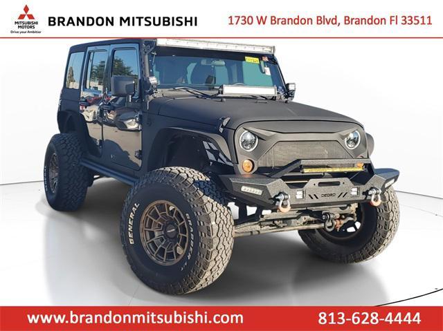 used 2011 Jeep Wrangler Unlimited car, priced at $11,555