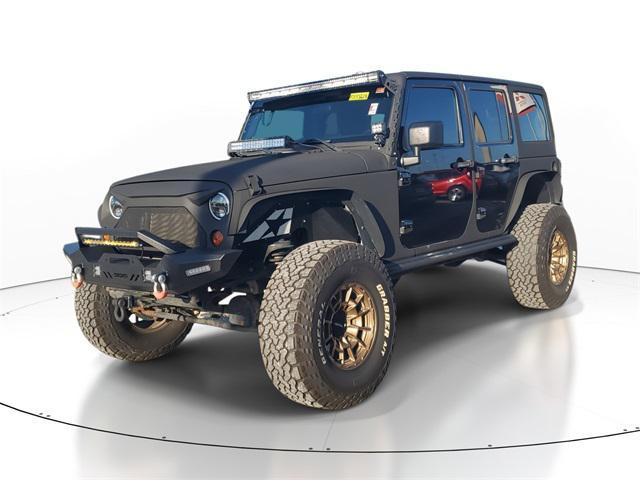 used 2011 Jeep Wrangler Unlimited car, priced at $11,555